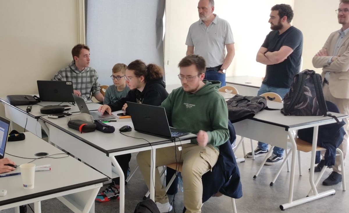 Photograph of Brice Ledanois at a hackathon